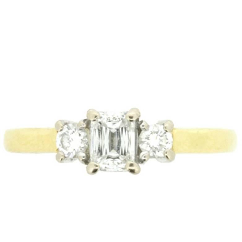 Vintage Emerald and Round Brilliant Cut Three-Stone Diamond Engagement Ring