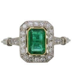 Art Deco Emerald and Diamond Halo Ring, circa 1920s
