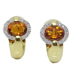 Diamond and Topaz Omega Back Yellow Gold Earrings