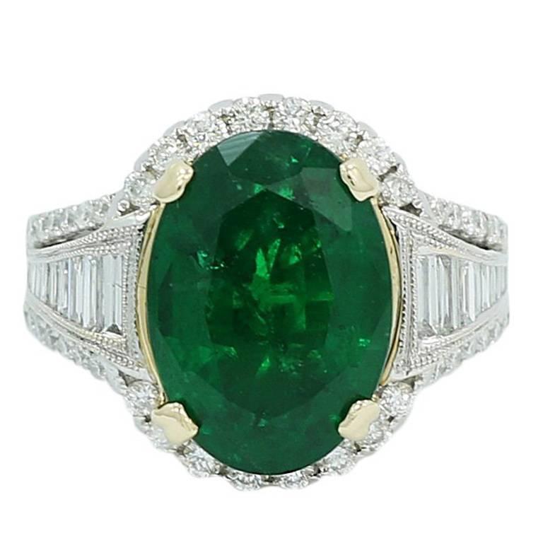 Oval 7.25 Carat Emerald and Baguette Diamond White Gold Engagement Ring For Sale