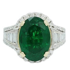 Oval 7.25 Carat Emerald and Baguette Diamond White Gold Engagement Ring