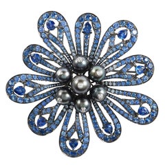 SAM.SAAB Sapphire and White Diamond Flower Motif Brooch