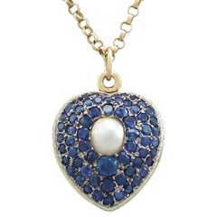 Antique Pearl and 3.49 Carat Sapphire 18 Karat Yellow Gold Heart Locket