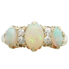 Antique 1.25 Carat Opal 0.20 Carat Diamond 18 Karat Yellow Gold Trilogy Ring