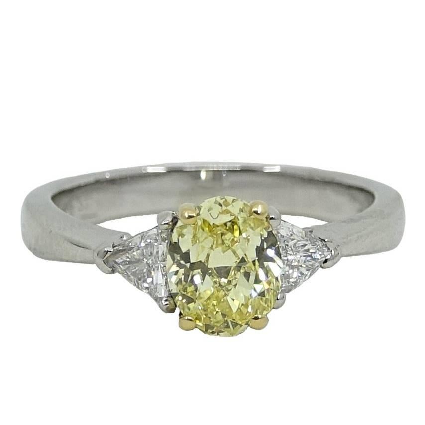 Oval Brilliant Fancy Intense Yellow Diamond Platinum Engagement Ring For Sale