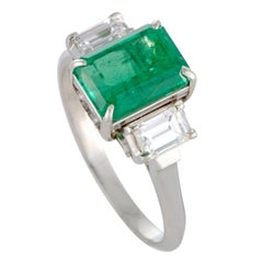 Diamond and Emerald Three-Stone Platinum Ring Diamond and Emerald Three-Stone Platinum Ring