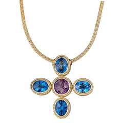 Reversible 18 Karat Yellow Gold Cross with Blue Topaz Amethyst and Diamonds