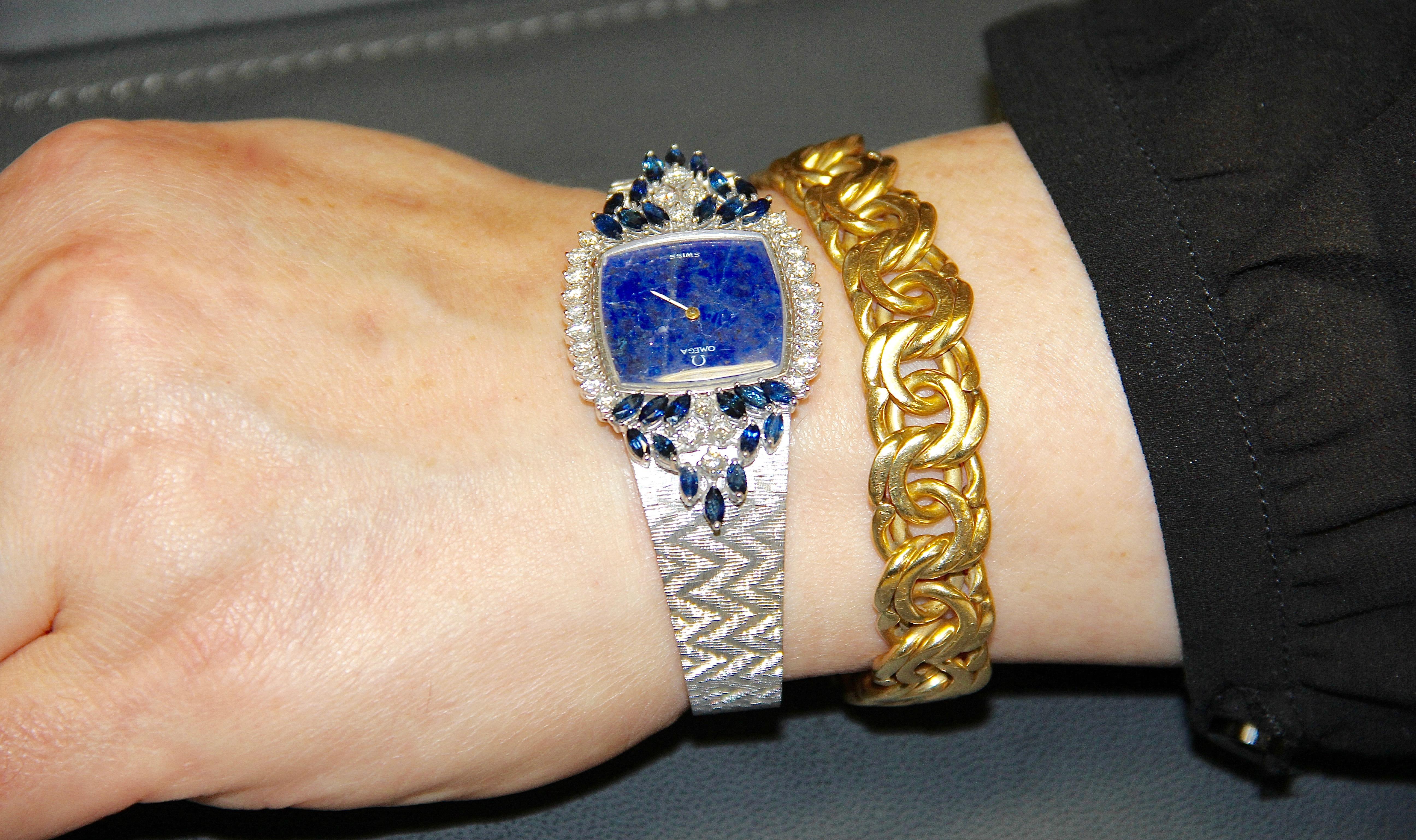 Round Cut Magnificent Ladies Wristwatch, Omega 18 Karat Gold with Diamonds and Sapphires