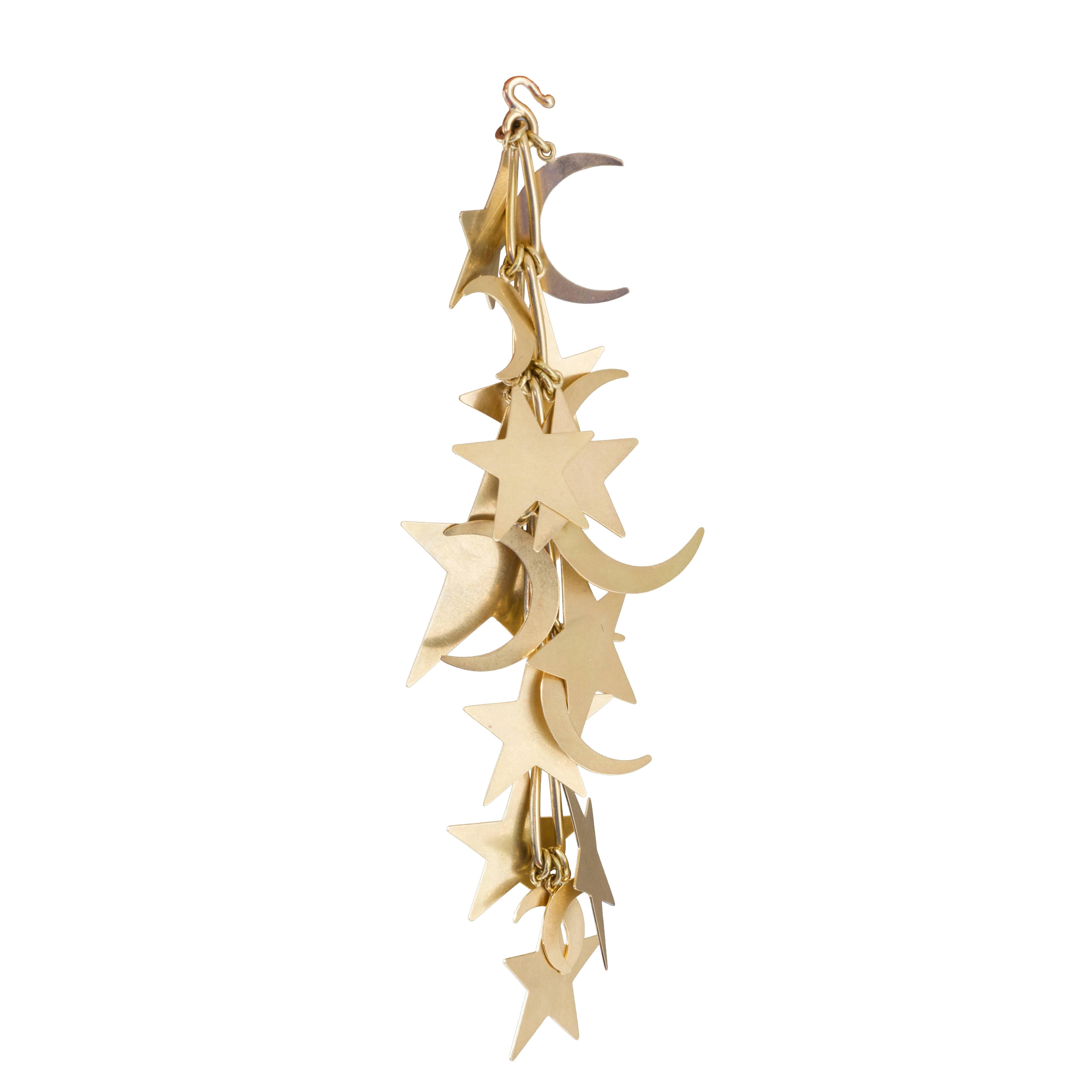 Gold Stars and moons Mechanical Moveable Pendant For Sale