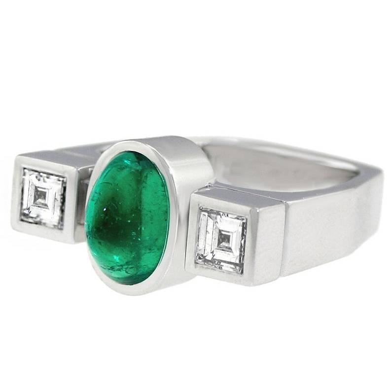 Circa 1960s-70s, 18k, Attributed Kurt Aepli for Trudel, Zurich Switzerland.  Modernism runs wild in a rectilinear landscape as this 18k ring rationalizes Art Deco with contemporary design. The emerald offers a vivid visual counterpoint to the