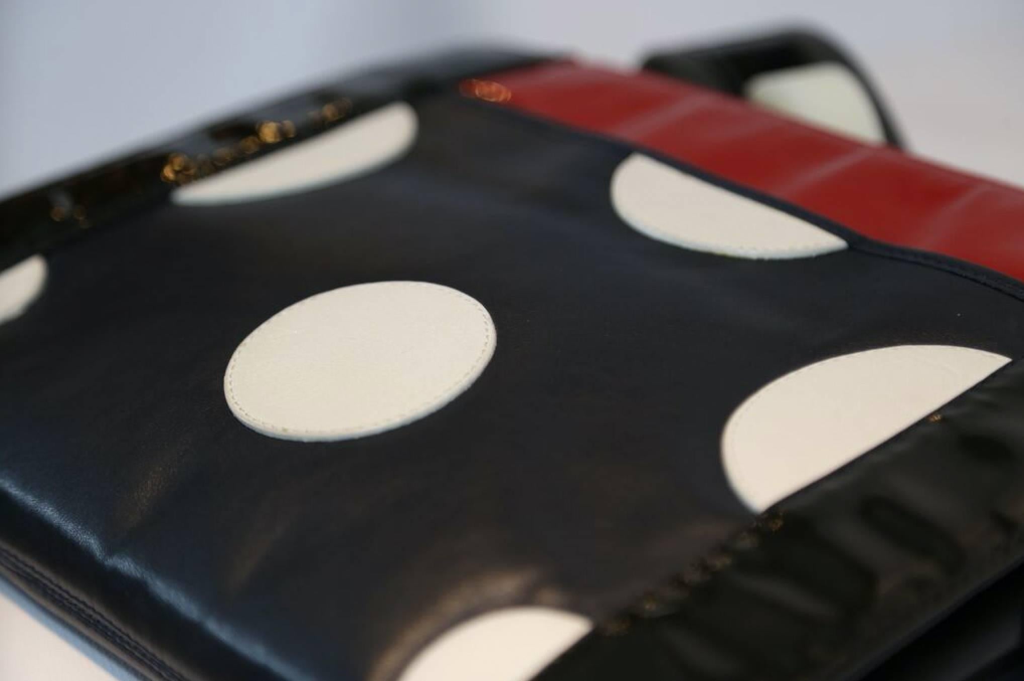 Fendi black, red, and white polka dot clutch. Matte leather with patent leather edges and zip enclosure. 