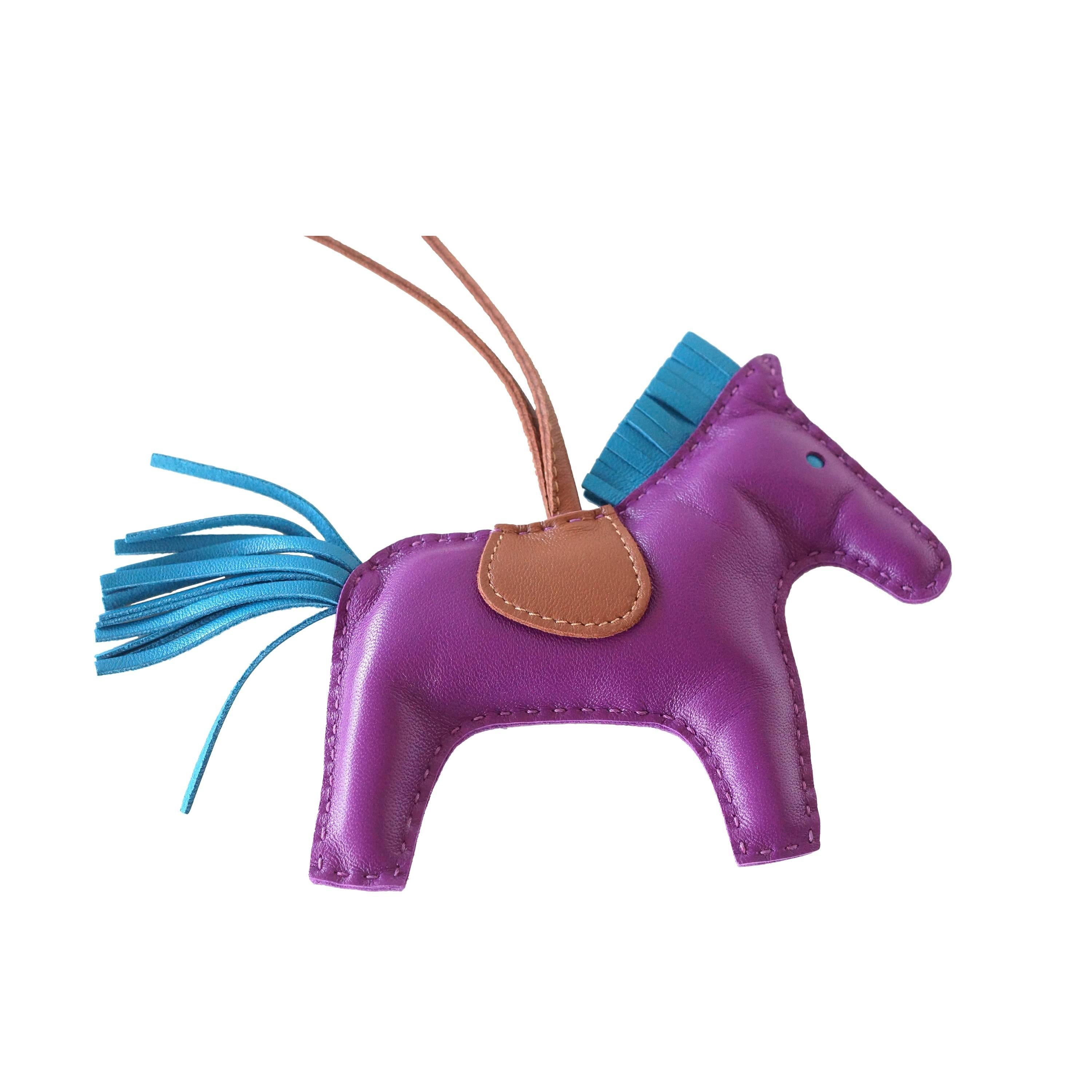Guarranteed authentic rare limited Hermes Rodeo MM Anemone Rodeo horse bag charm with Bleu Izmir tail and mane.
La selle et le support sont Fauve.
La peau est de l'agneau Milo.  
La signature HERMES PARIS MADE IN FRANCE est estampillée sous la