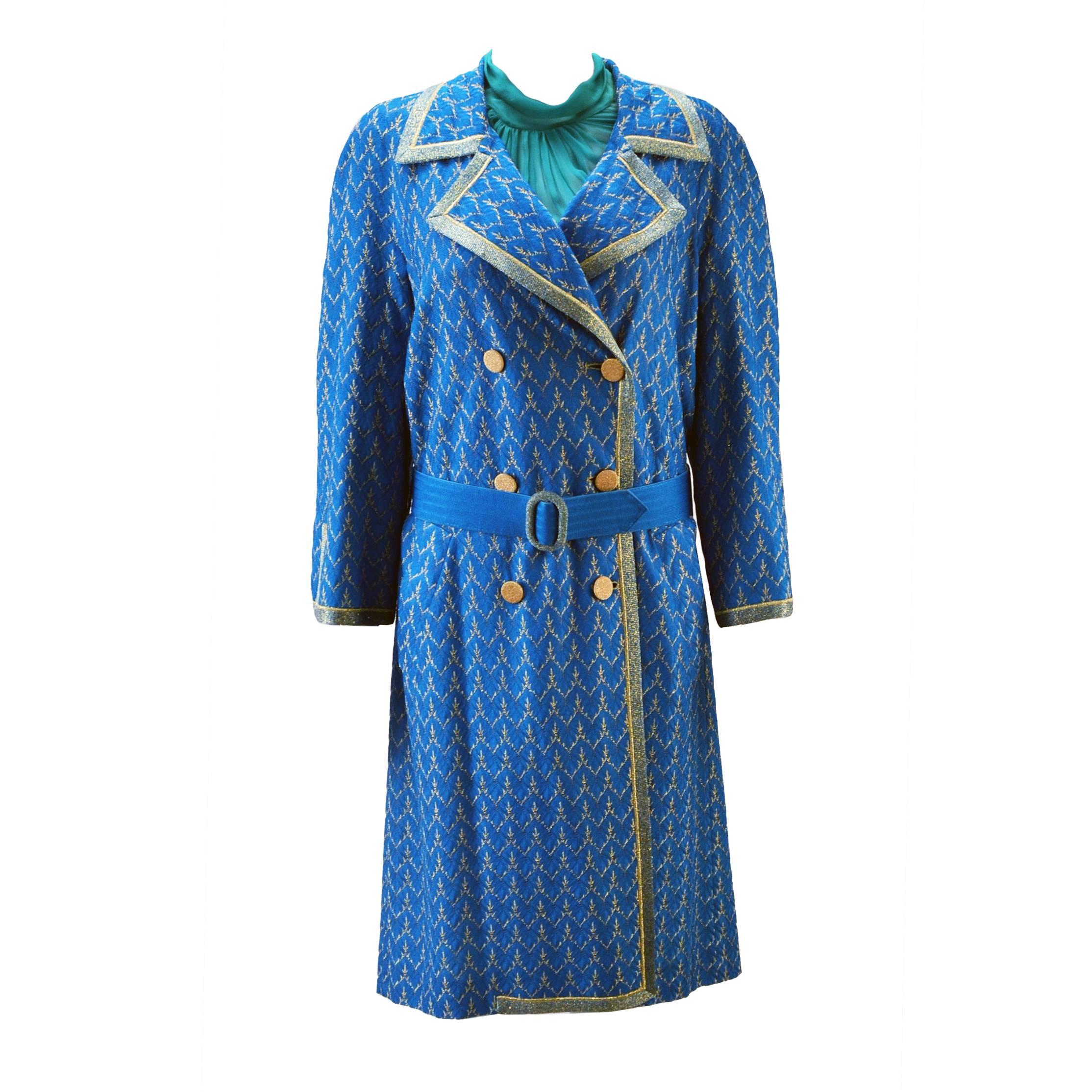 Stunning Missoni coat and dress ensemble. Vibrant shades of blue, teal and metallic gold give this dress an element of daytime extravagance along with it's sheer silk fabric that ties at neck back with long tails creating drama with just a slight