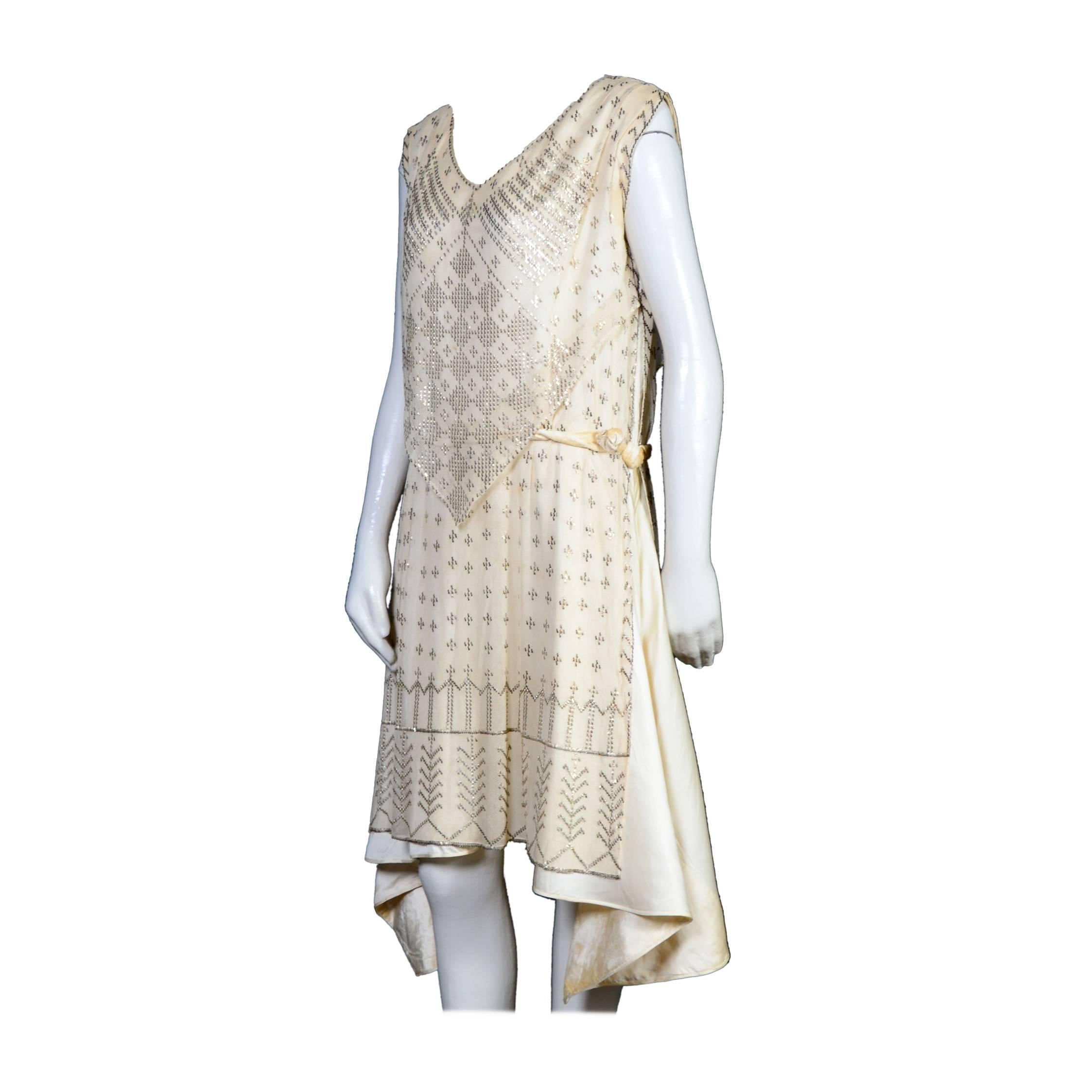 Authentic 1920's Art Deco Era Assuit dress, a rare example in cream cotton netting mesh with hand-applied spangles. Under layer soi sauvage and velvet. Although there are no tags, I am quite sure that this would have originally had the 