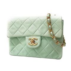 Vintage CHANEL milky blue lambskin purse with golden CC and chain strap. 