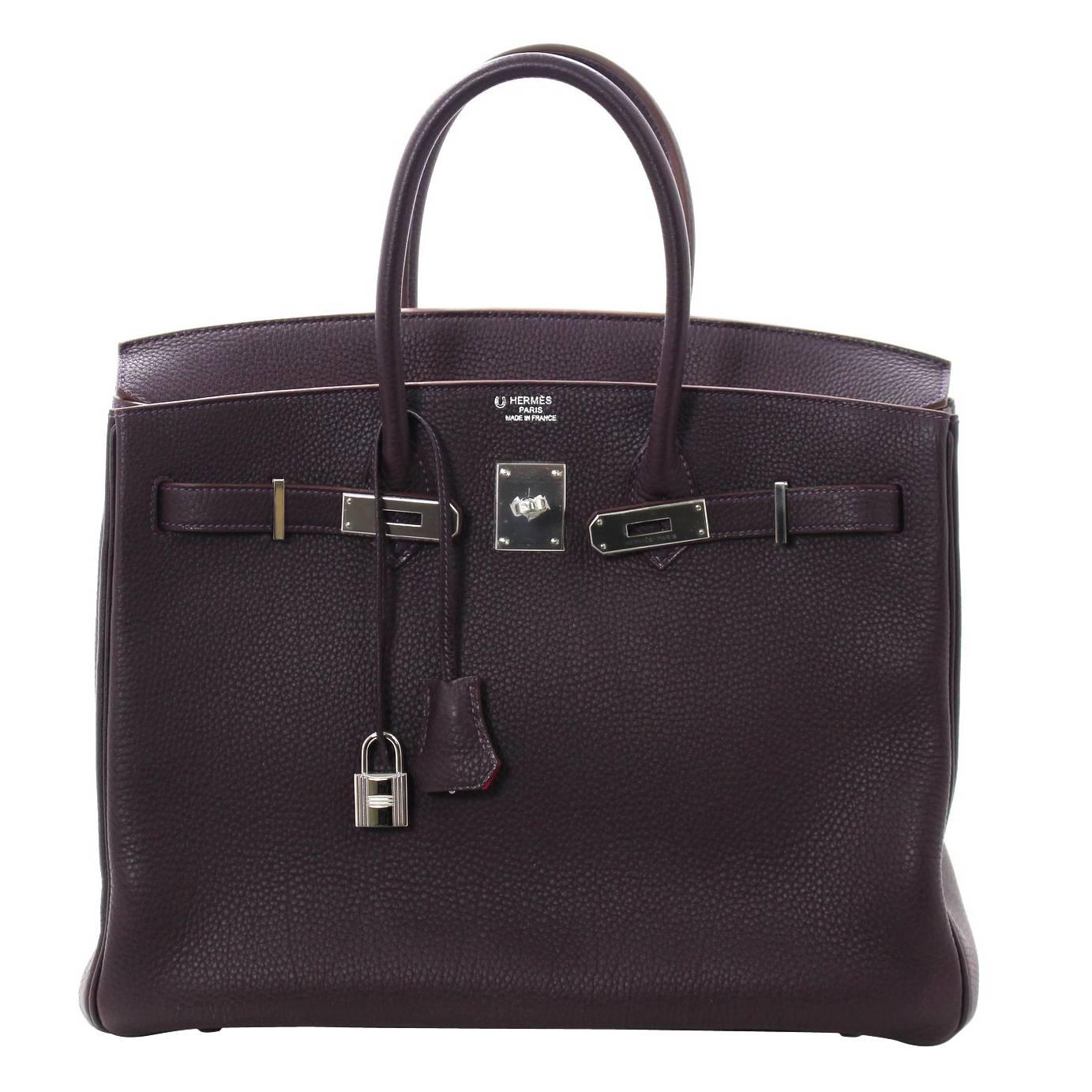 Pristine, store fresh condition (plastic on hardware) Hermès Birkin Bag in PRUNE Purple Togo Leather with ROSE SHOCKING interior, PHW 35 cm, P stamp
Crafted by hand and considered by many as the epitome of luxury items, Birkins are in extremely