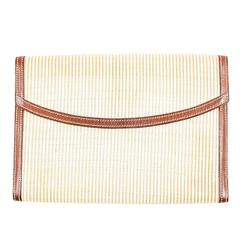 Lot 21 - A HERMES RIO CLUTCH BAG - לתירוש