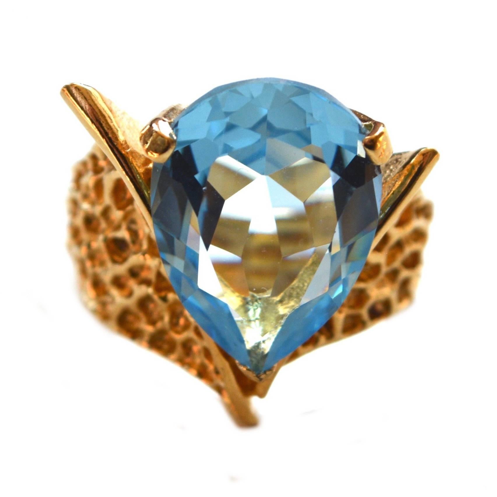 Signed Panetta sterling gilt blue glass ring. Larger cut glass stone is vibrant and in excellent condition. Size 7. Face is about .75