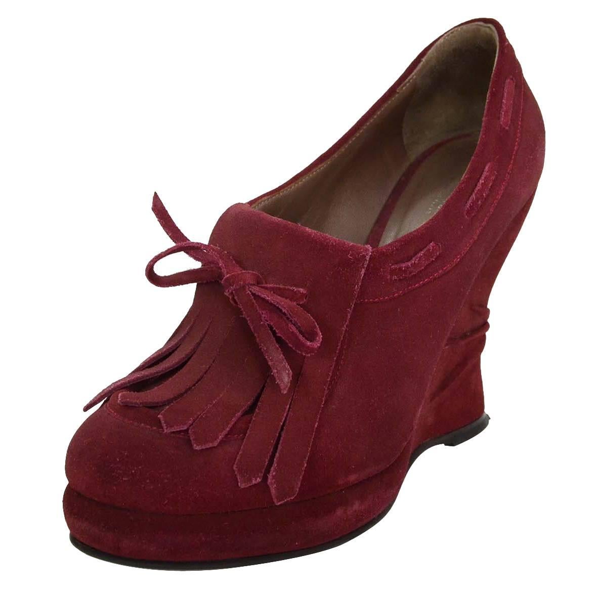 Bottega Veneta Suede Oxford Wedges 
Features ruching at suede covered wedge

Made In: Italy
Color: Burgundy
Materials: Suede
Closure/Opening: Pull on
Sole Stamp: Bottega Veneta Made in Italy 40
Overall Condition: Excellent pre-owned condition with
