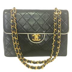 Vintage Chanel black and white lambskin 2.55 shoulder bag with golden chains