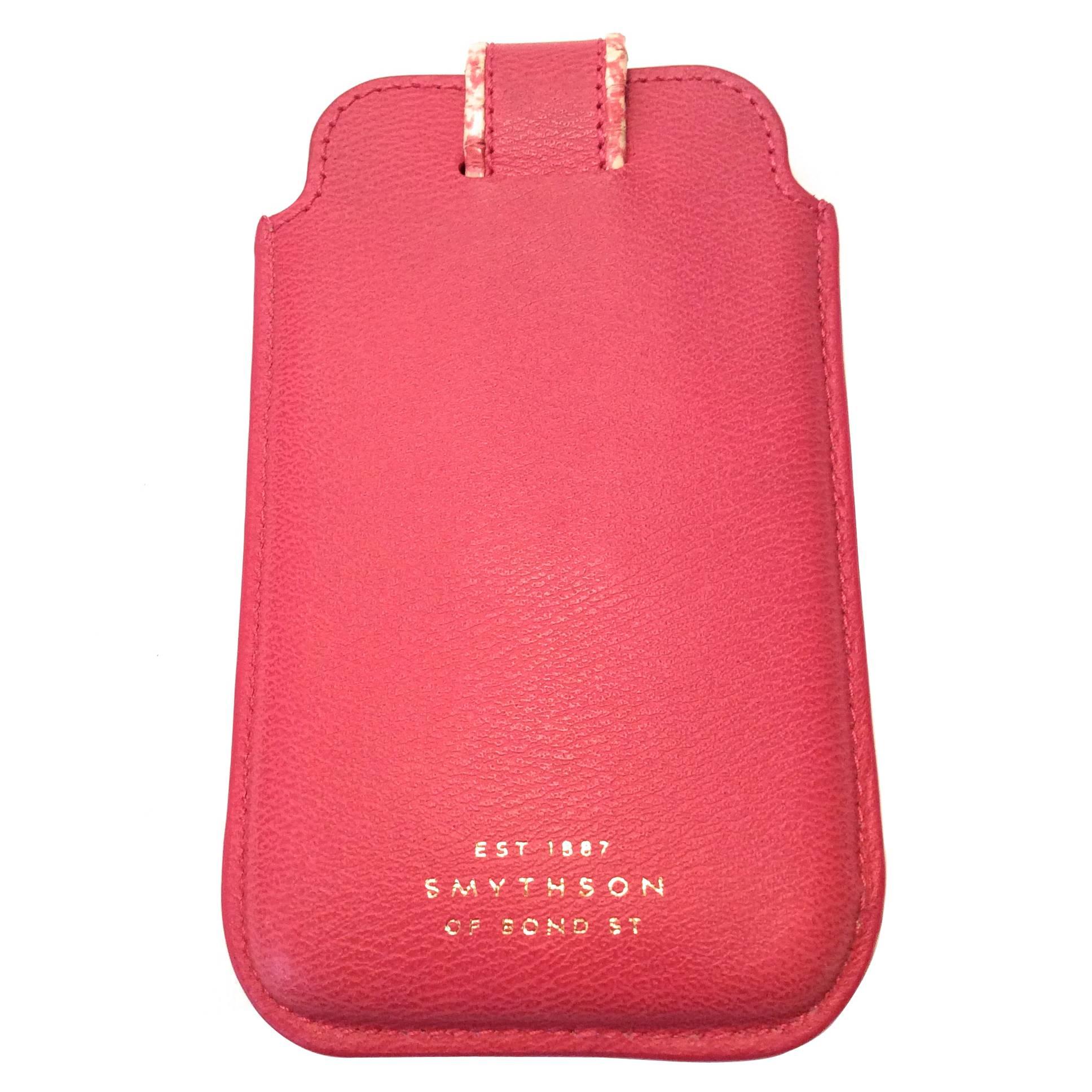 This Smythson of Bond Street pink cell phone / credit card holder is a great example of the craftsmanship of Smythson products. The case is made of out beautifully designed pink leather. The enclosure is trimp with a beautiful white and pink python