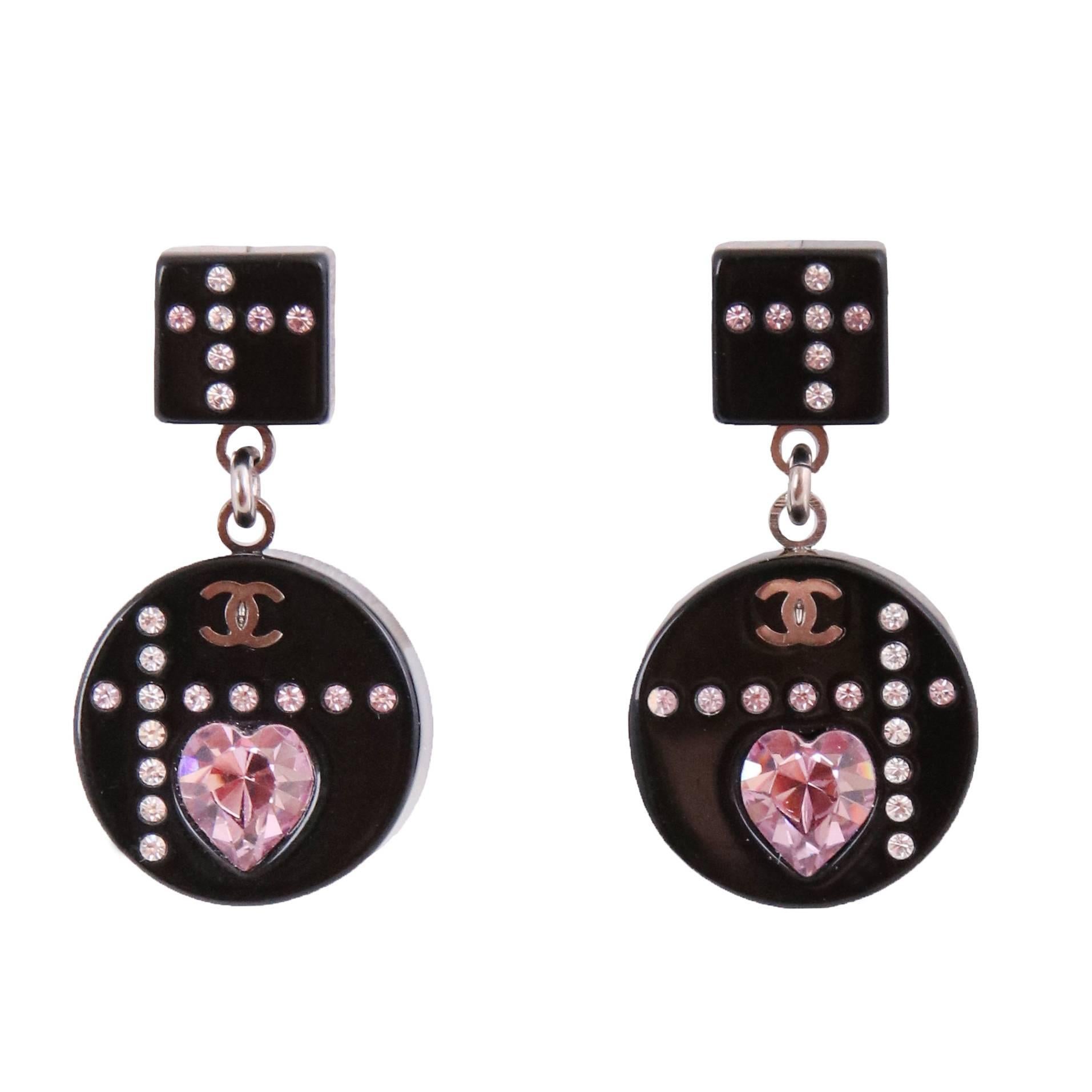 The cutest 2004A Chanel black resin pierced dangling earrings made of micro-crystals, a pink crystal heart and featuring a mini CC logo - arranged in a graphic pattern. In excellent condition.
MEASUREMENTS:
Overall Length - (approx.) 1 1/8