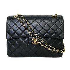 Vintage CHANEL black lambskin classic 2.55 double flap shoulder bag with cc