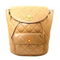 Vintage CHANEL brown beige lambskin backpack with golden chain straps with cc.