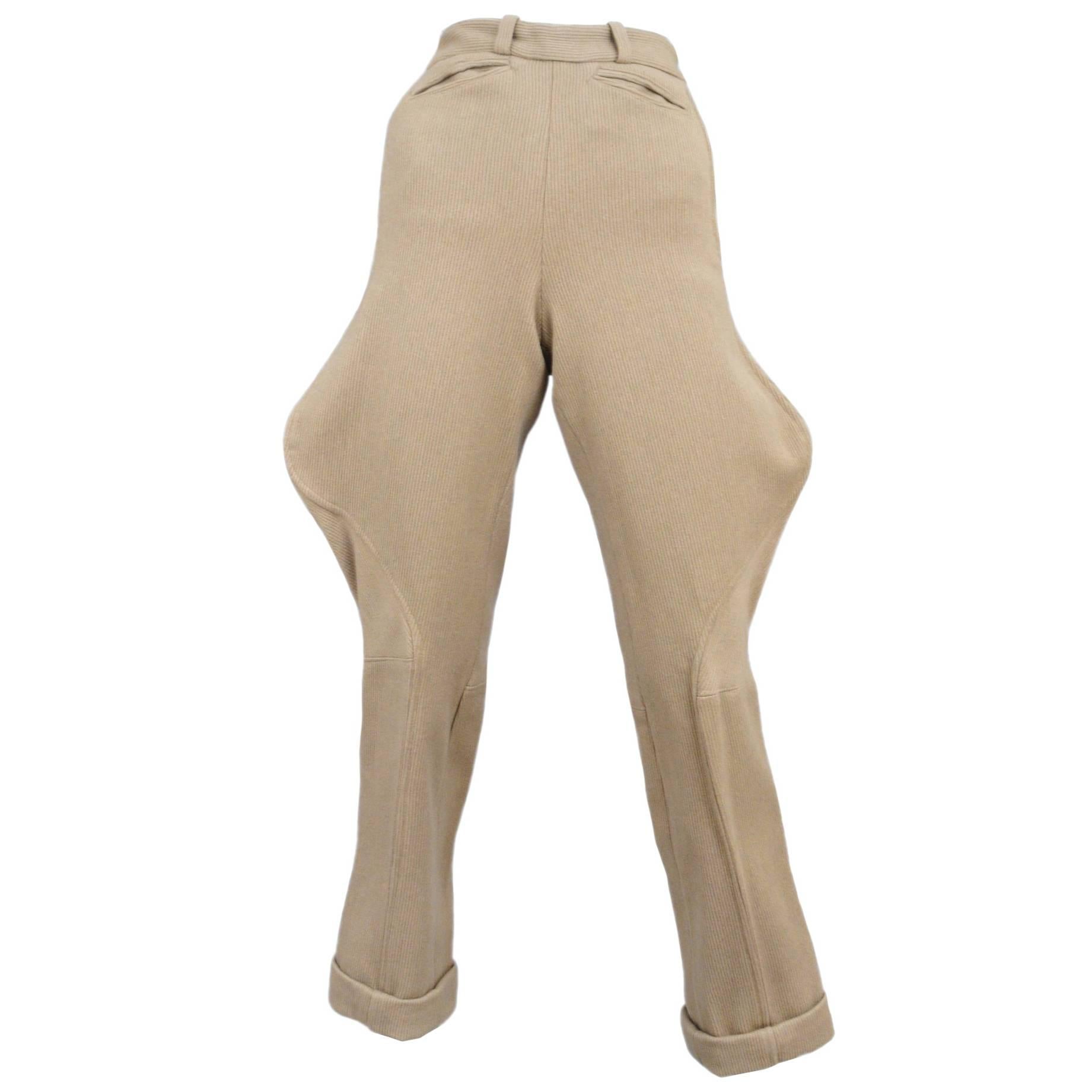 Vintage Chanel taupe ribbed wool jodhpurs featuring front welt pockets and brass studs at the back calfs.

Please contact us for additional photos.