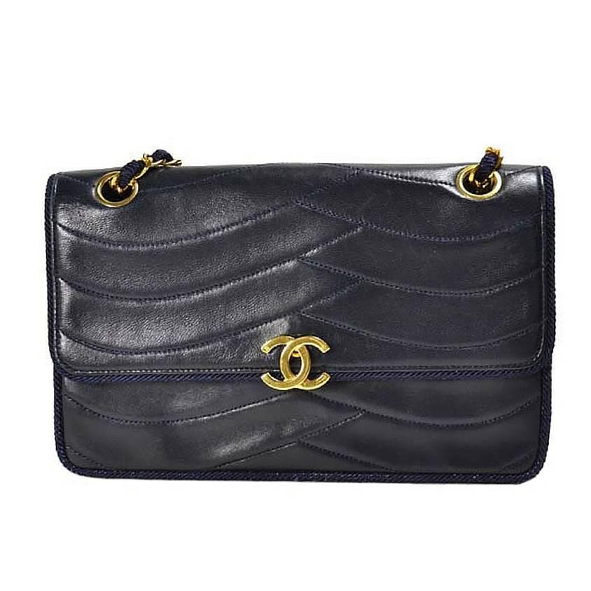 Vintage Chanel navy 2.55 bag in fish scale stitch with matching rope and chains.