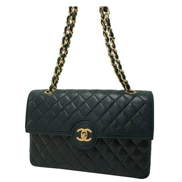 80s. Vintage Chanel rare 2.55 classic black bag with round and golden CC closure