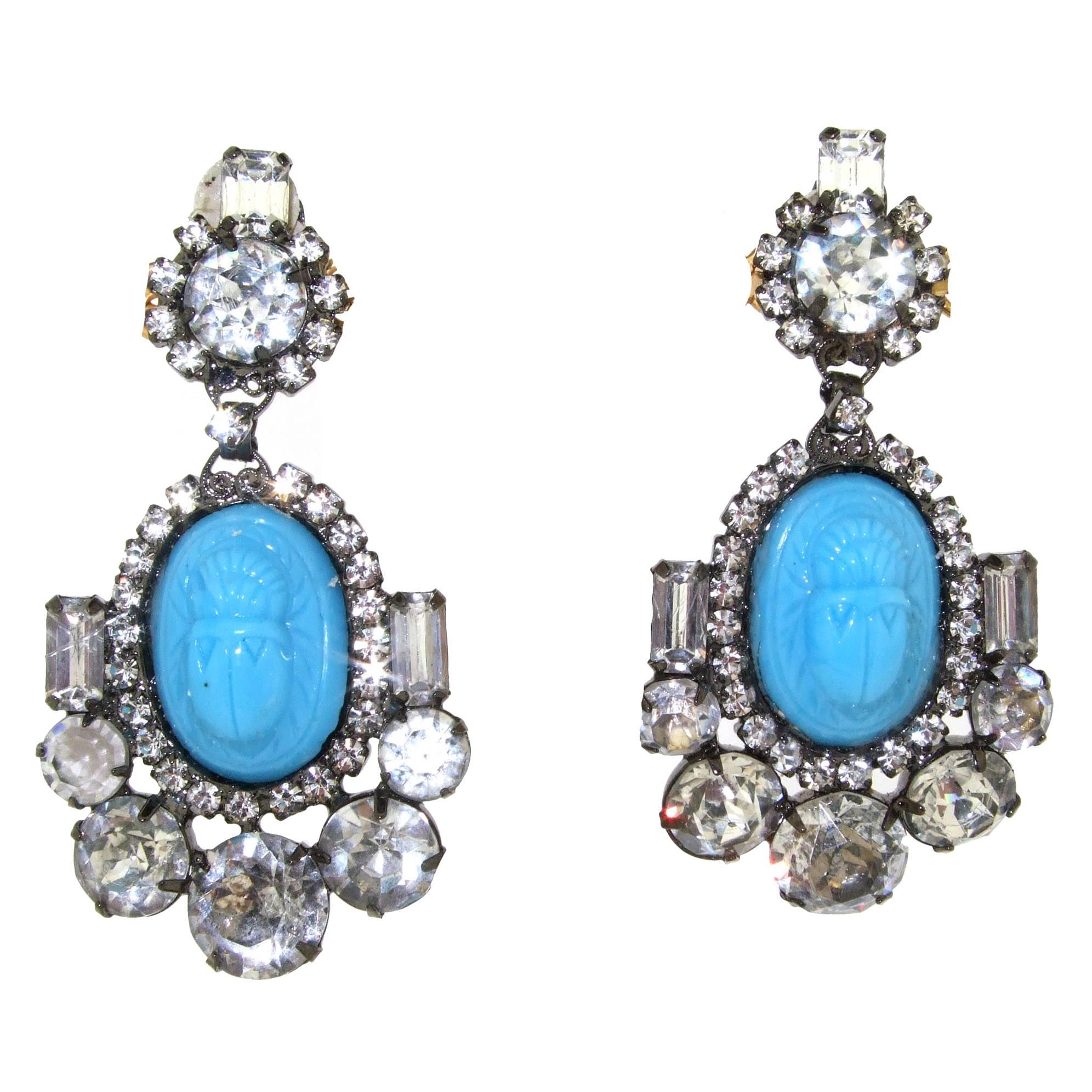 Turquoise glass scarab chandelier earrings by Moans Couture.
