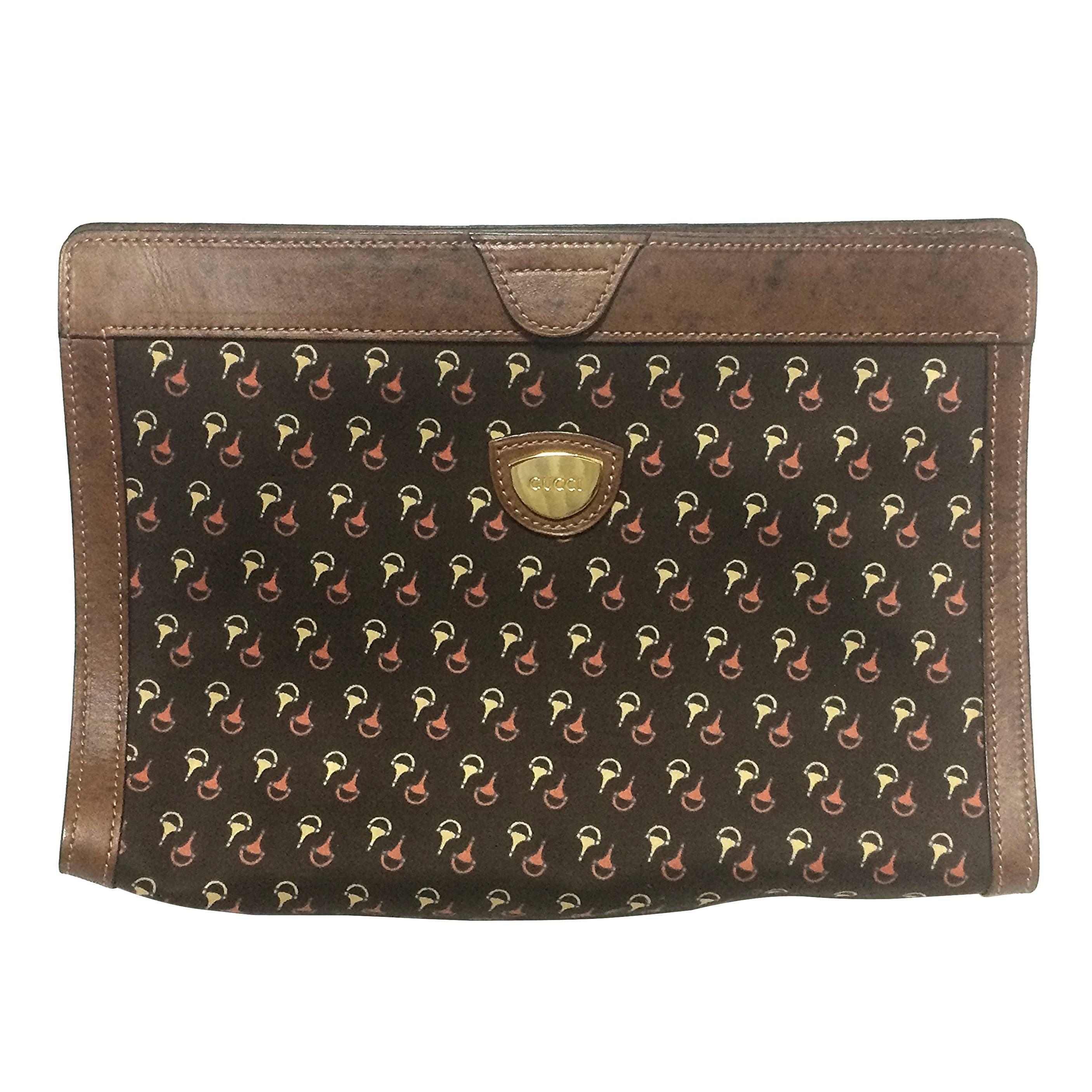 Vintage Gucci brown toiletry clutch pouch with all over horsebit print