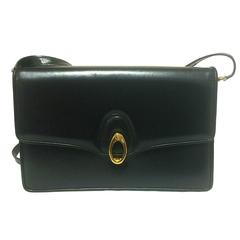 Vintage Gucci black leather shoulder bag with golden logo embossed oval mot
