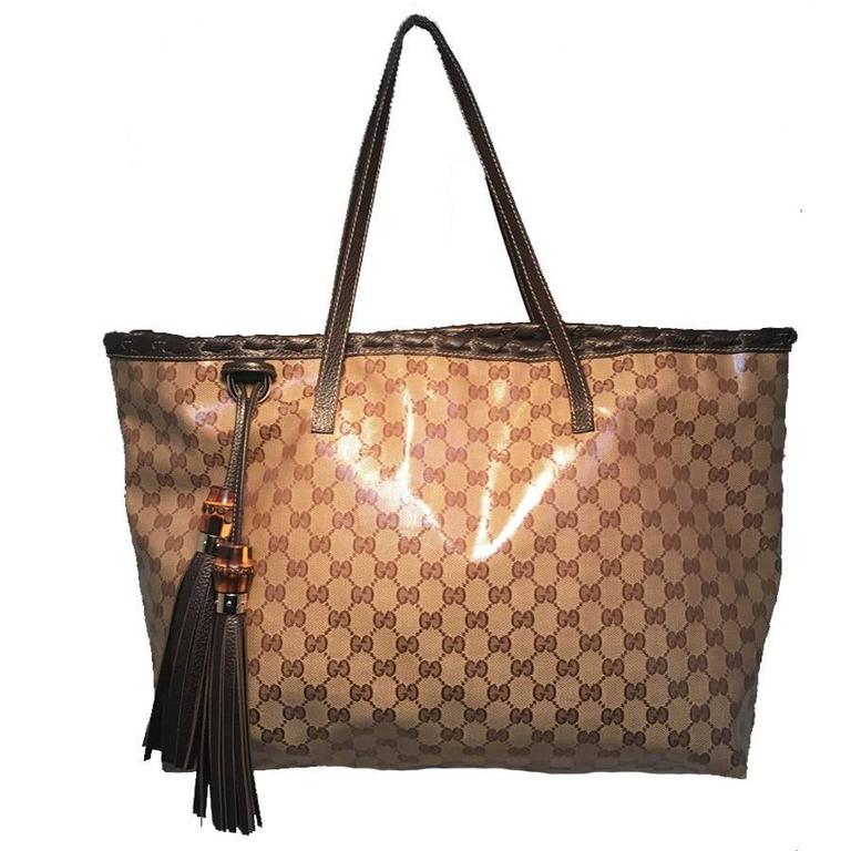 Gucci Coated Monogram Canvas and Braided Leather Trim Tassel Shoulder Bag Tote For Sale at 1stdibs