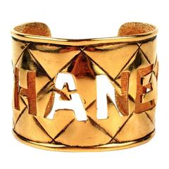 Chanel Vintage Bracelet - Cutout Logo Cuff Quilted Gold Bangle Rare CC