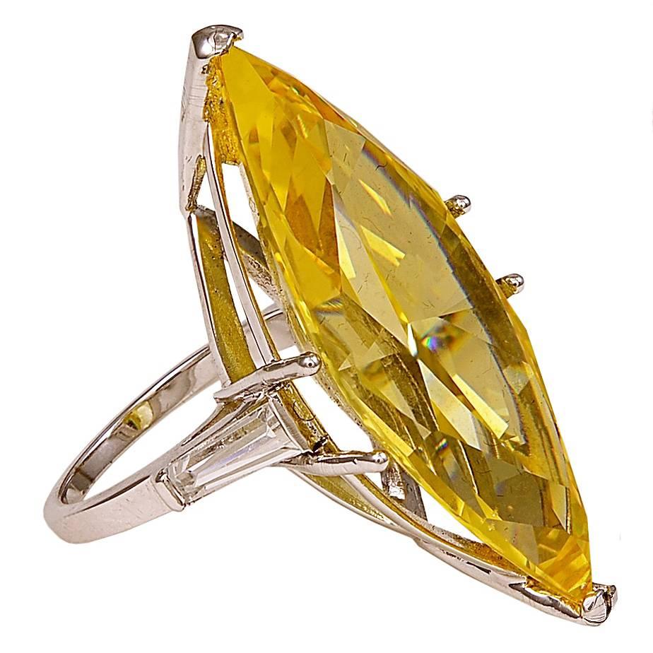 A Fabulous Fake. One for sale here, the other sold at Sotheby's by Daniele Steele that had been bought at Bergdorfs in the 1990s.
A copy of the Real One made in canary yellow cubic zircon cut by a NYC diamond cutter. Sides set with tapered CZ