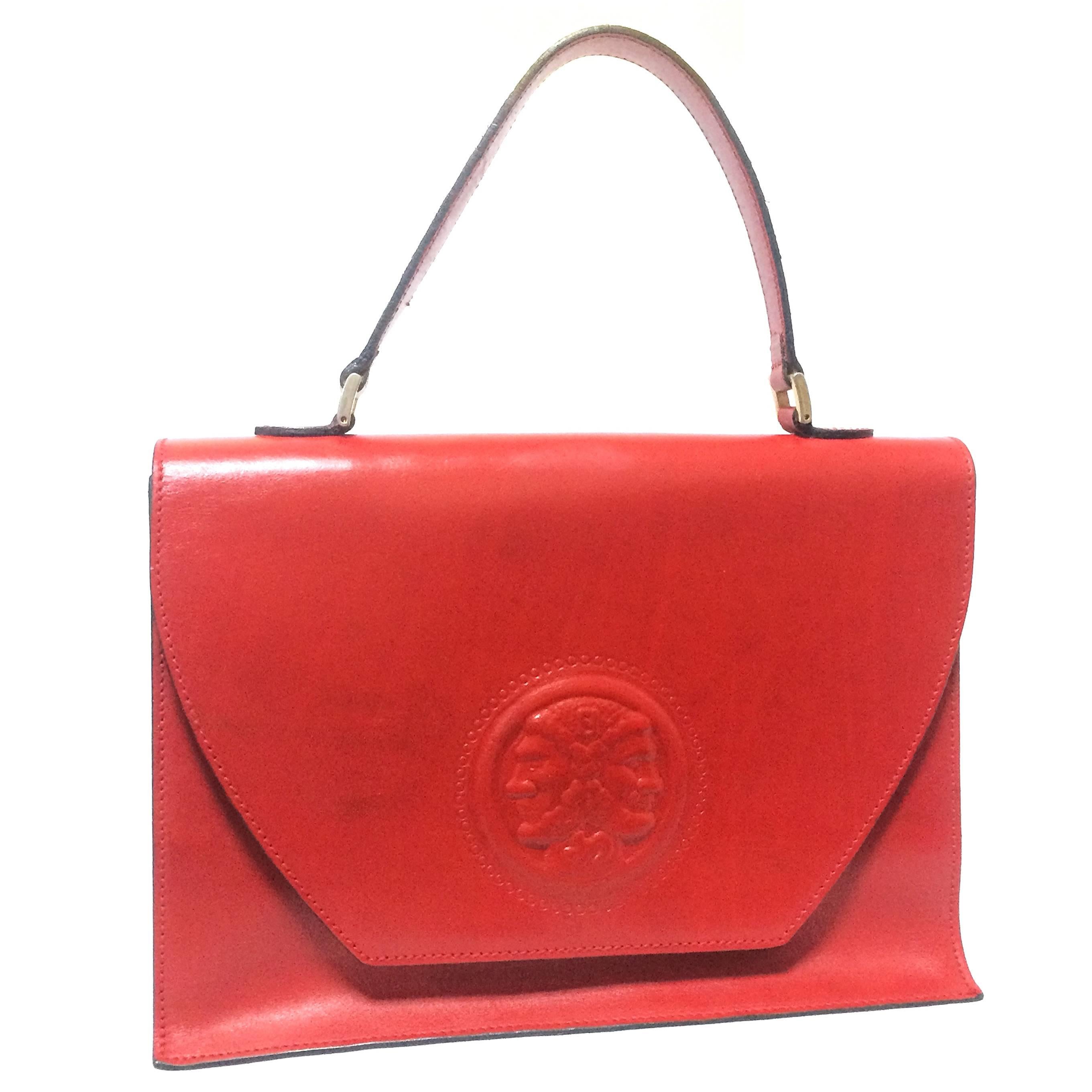 Vintage FENDI genuine red leather classic handbag with embossed Janus medallion. For Sale