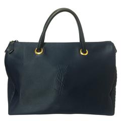 MINT. Vintage Yves Saint Laurent navy nylon duffle handbag with YSL logo