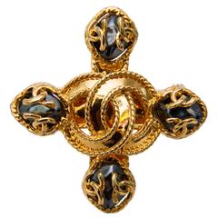 A '95 Chanel Gold Toned Cross Broach 