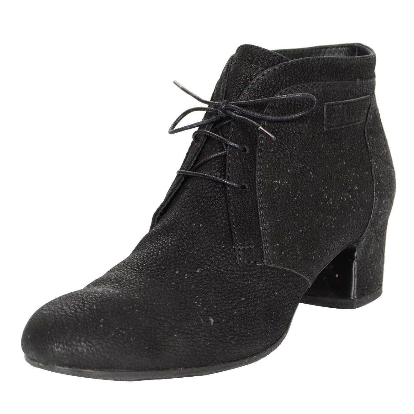 Chanel Black Suede Ankle Boots Sz 42
Features quilting at heels

Made In: Italy
Color: Black
Materials: Suede
Closure/Opening: Lace tie closure
Retail Price: $1,175 + tax
Overall Condition: Excellent pre-owned condition with the exception of