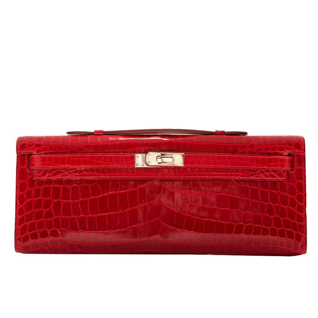 Hermes Braise Red Kelly Cut in shiny Porosus Crocodile withsilver​ hardware.