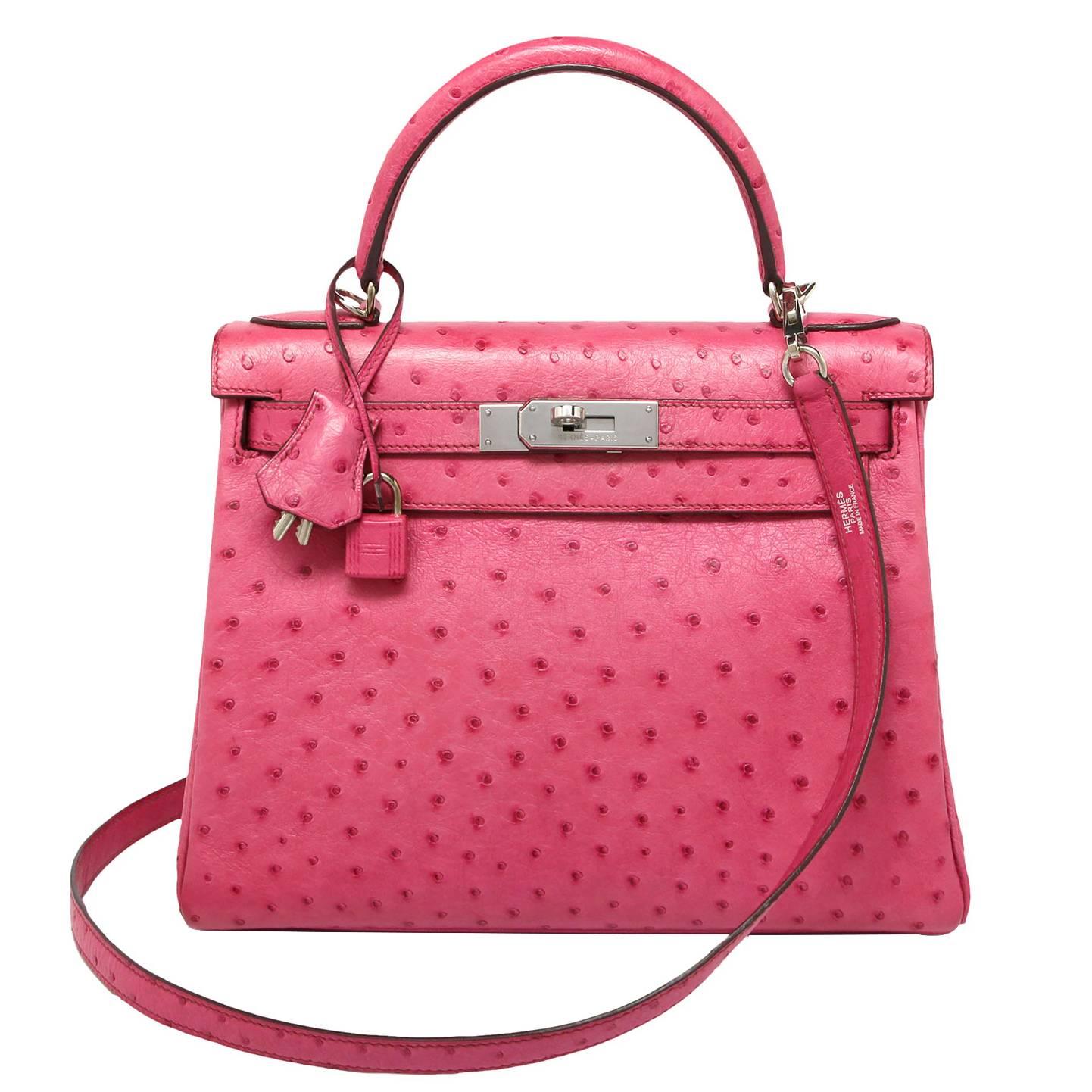 Hermes Kelly retourne fuchsia
Ostrich
Palladium hardware 
Stamp: I Square 2001
Comes with Hermes cloth bag, strap, clochette, lock & keys.

This colour is currently discontinued in ostrich so makes it a rare piece.