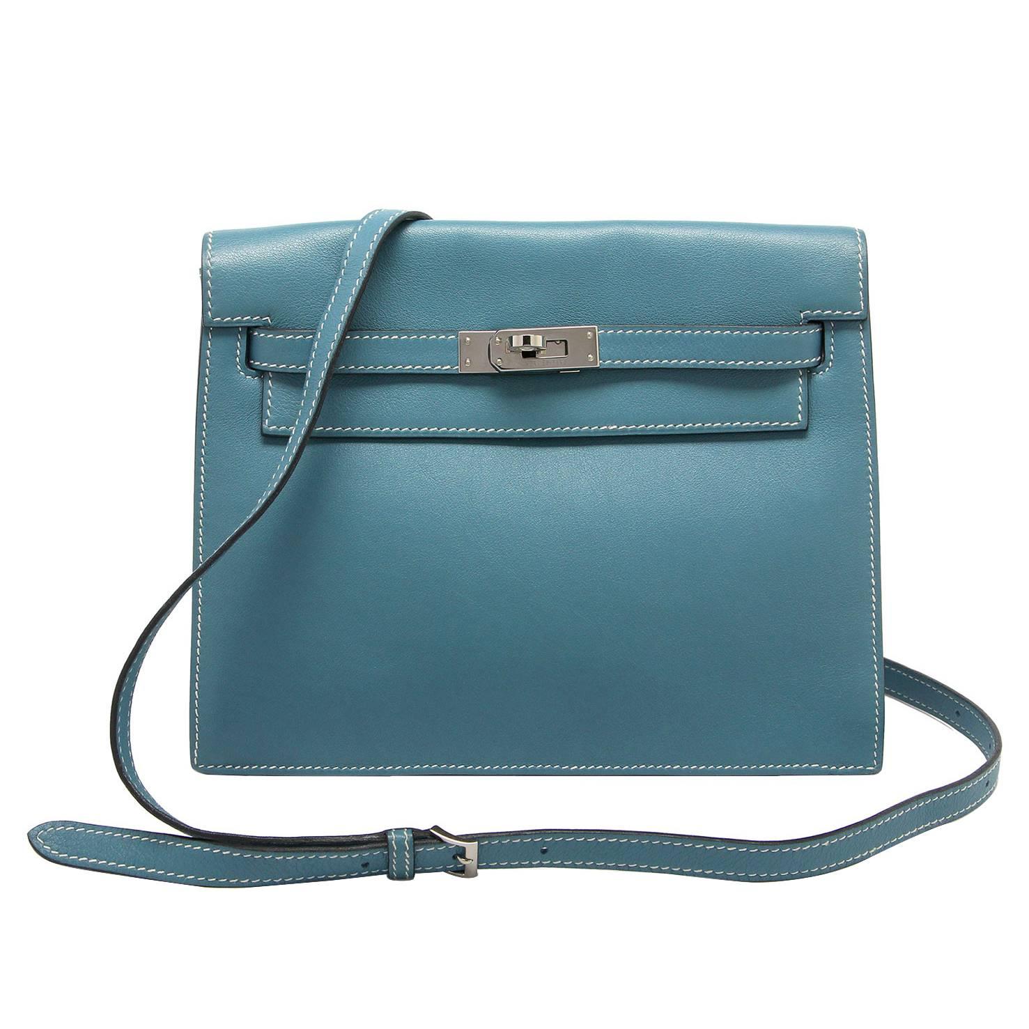 Hermes Kelly Danse 
Blue Jean
Swift 
Palladium Hardware
Stamp: M Square 2009
Comes with Hermes cloth bag & strap.

Hermes do not make this style of bag anymore.  It works as a great shoulder bag or clutch.