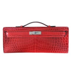 Hermès Kelly Crocodile Cut Shiny Porosus Bouganvillea Clutch Bag in Box