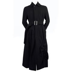 COMME DES GARCONS jet black wool coat with knot detail
