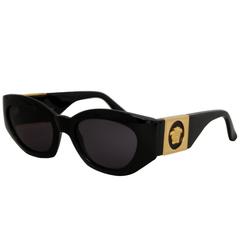 A Pair of 1990s Gianni Versace Black Frame Sunglasses W. Gold Colored Medusa