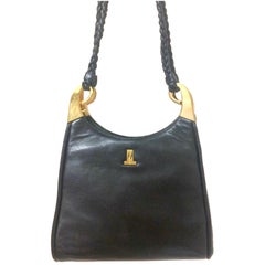 Vintage LANVIN sac à bandoulière en cuir noir de forme trapézoïdale avec fermeture kiss lock