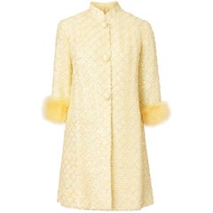 Yellow sequin applique, feather and ribbon coat & dress ensemble, circa 1967