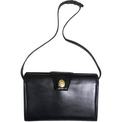Vintage CELINE genuine black leather shoulder bag with golden blason logo motif.